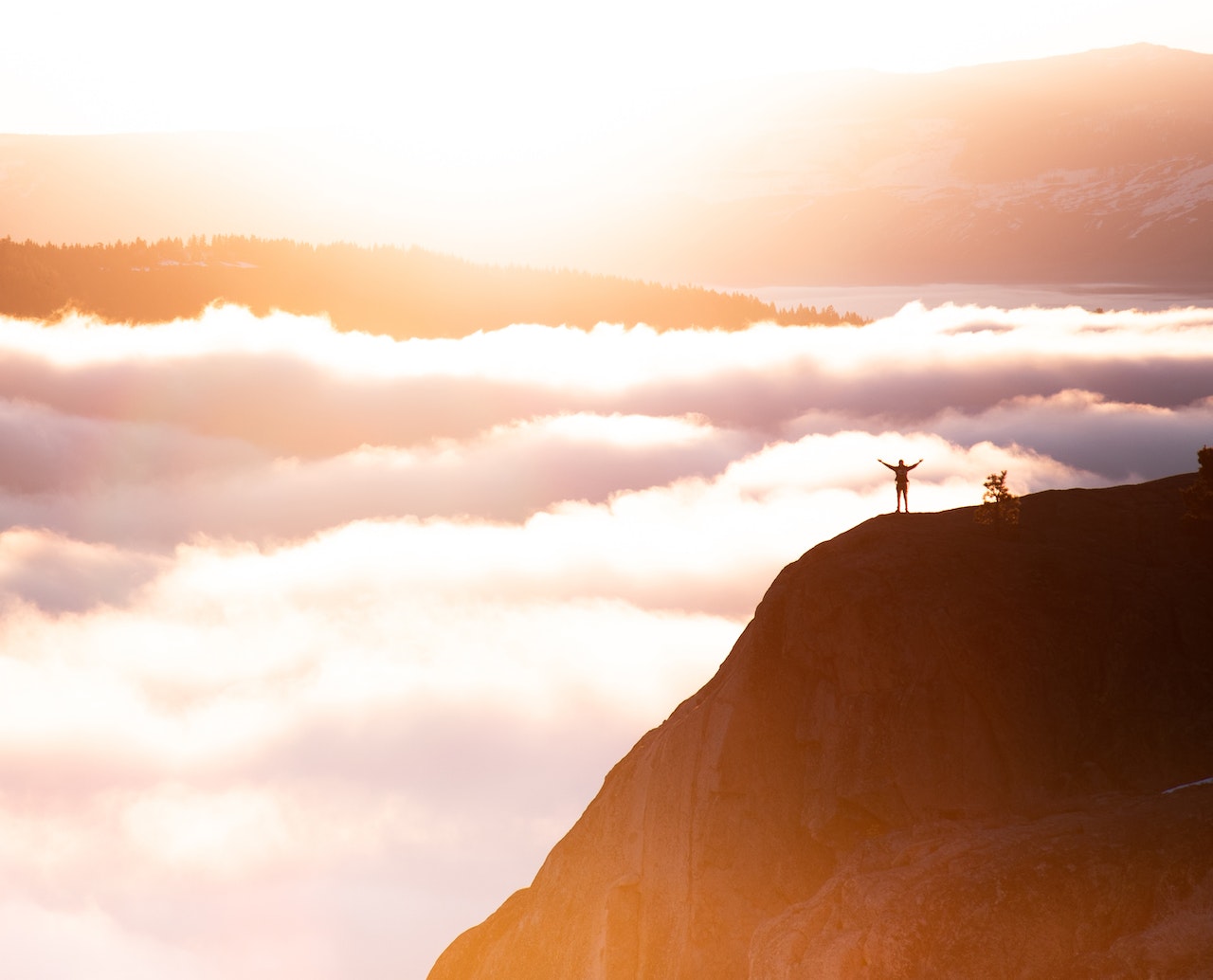 hiker above the clouds